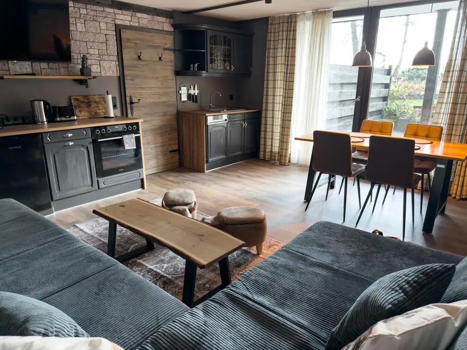Large corner sofa in front of the kitchen