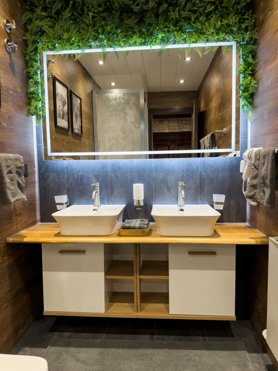 Bathroom with double vanity and illuminated mirror
