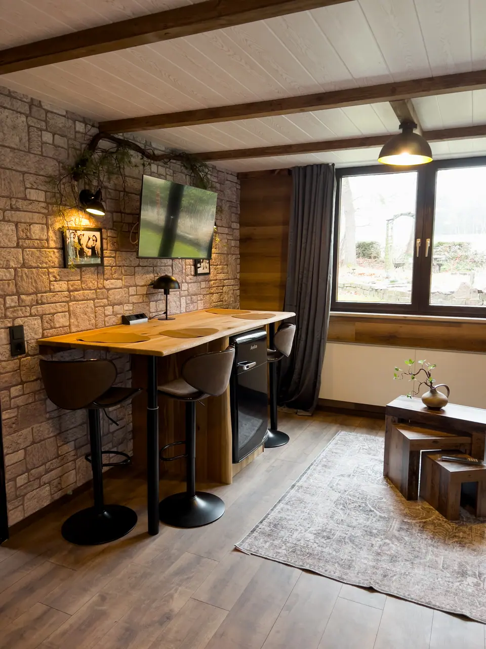 Living area with bar table and window