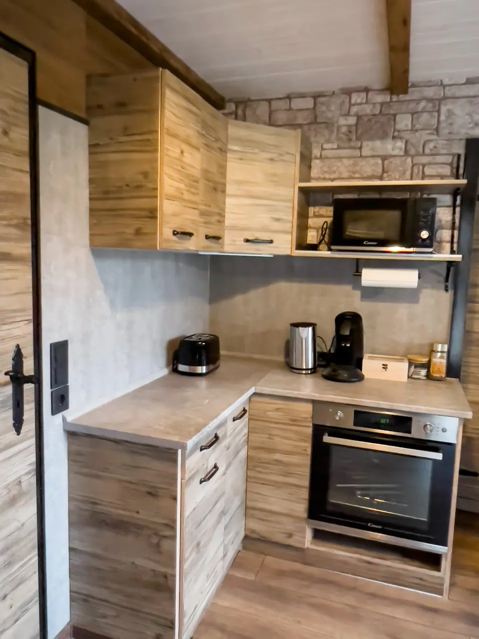 Kitchen with oven and microwave